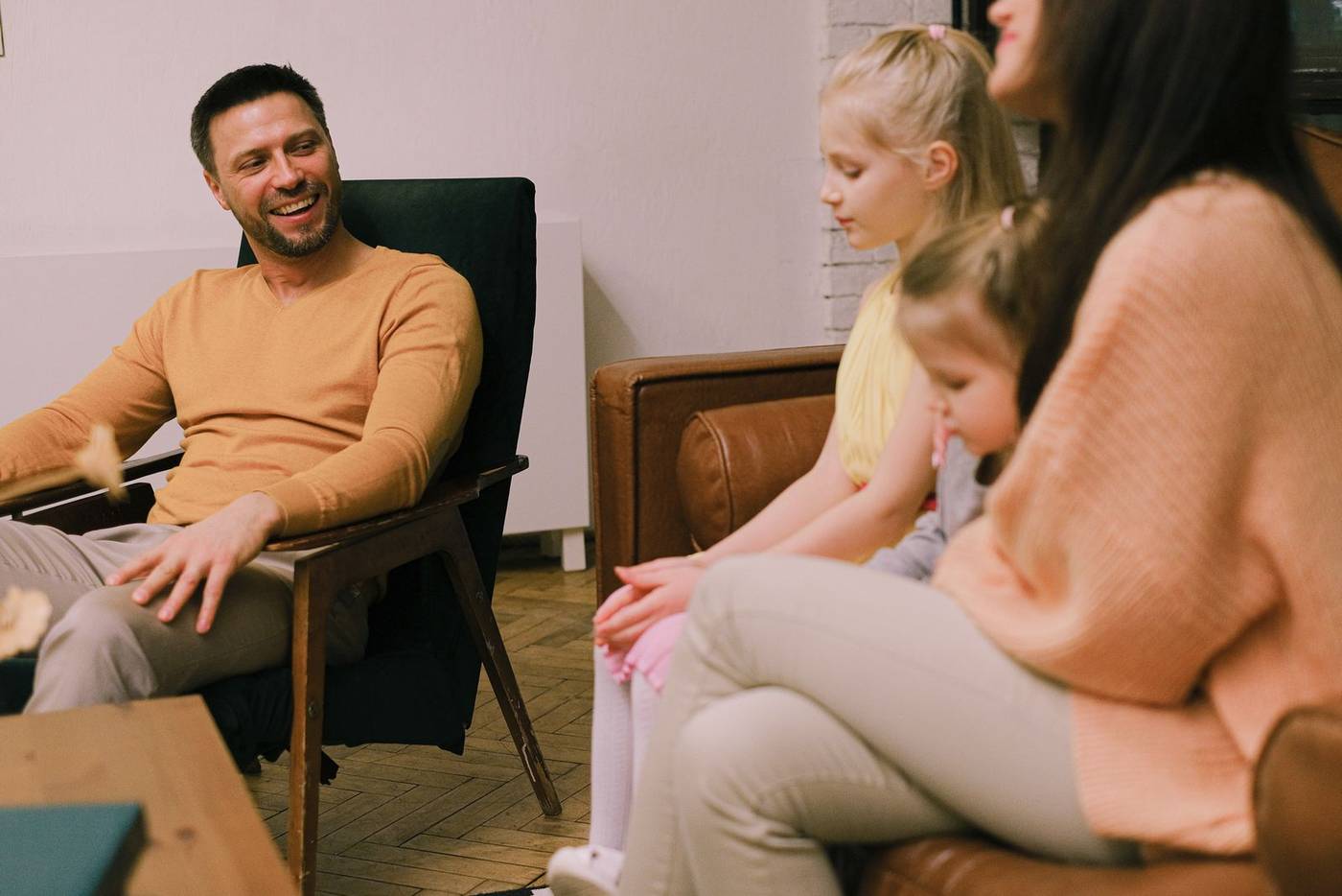 Family relaxing together at home in the evening
